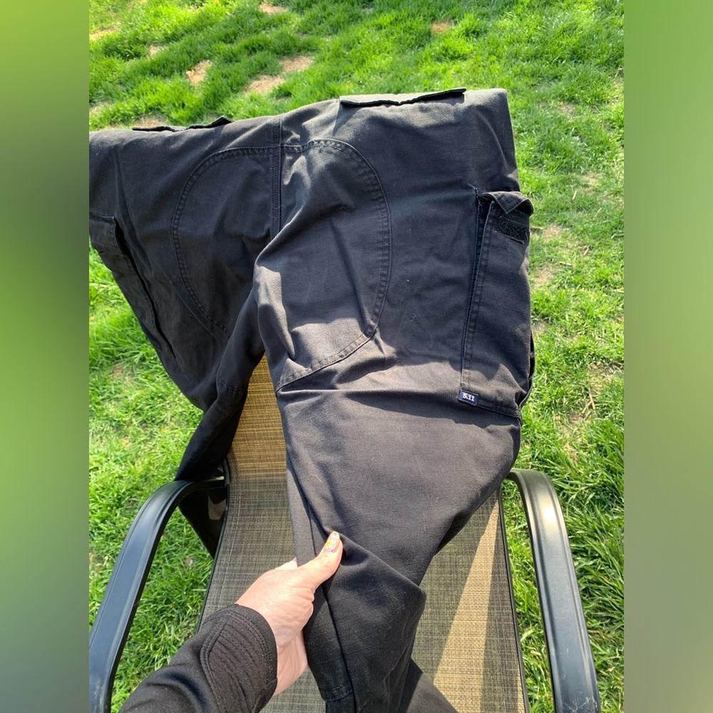 511 Black Cargo Tactical Pants w/ several pockets for equipment. Good condition